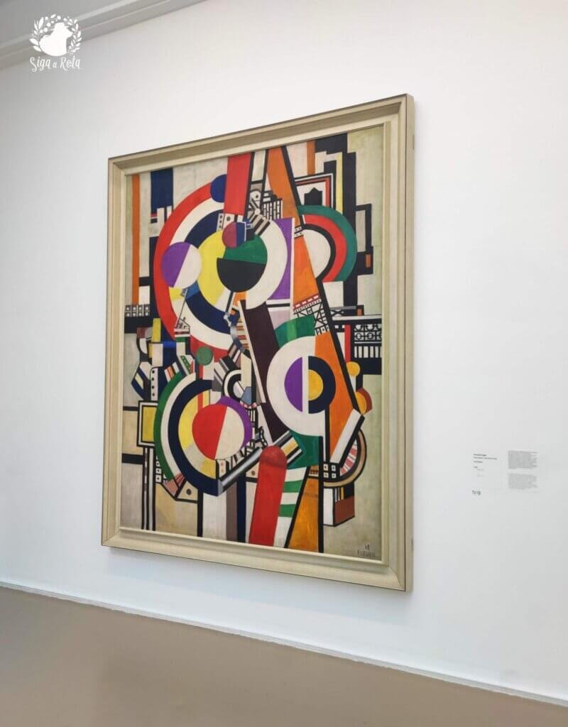 Quadro de arte abstrata de Fernand Léger, exibido no Museu de Arte Moderna de Paris, com formas geométricas e cores vibrantes.